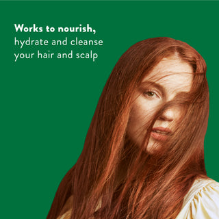 Woman with long red hair with text reading “Works to nourish, hydrate and cleanse your hair scalp”