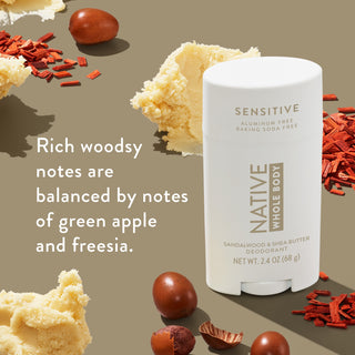 Native Whole Body Deodorant with shea butter and sandal wood sticks on beige background