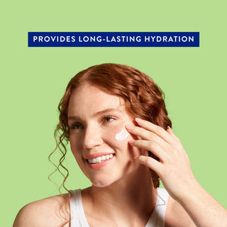 Smiling woman applying moisturizer to cheek with text: Provides long-lasting hydration on green background
