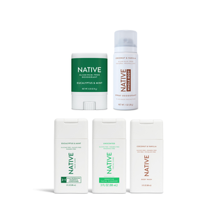 Arrangement of Native products in travel size version, Deodorant stick, spray deodorant, Shampoo & Conditioner, Sensitive Facial Cleanser, and Body Wash