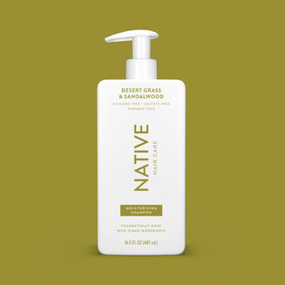 Front of Desert Grass & Sandalwood Moisturizing Shampoo bottle on brown background
