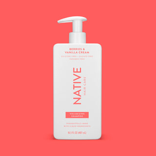 Front of Berries & Vanilla Cream Volumizing Shampoo bottle on pink background