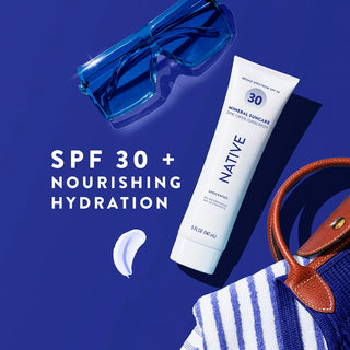 Tube of Native Mineral Suncare Daily Body Sunscreen SPF 30 next to a swatch of product, purse and sunglasses