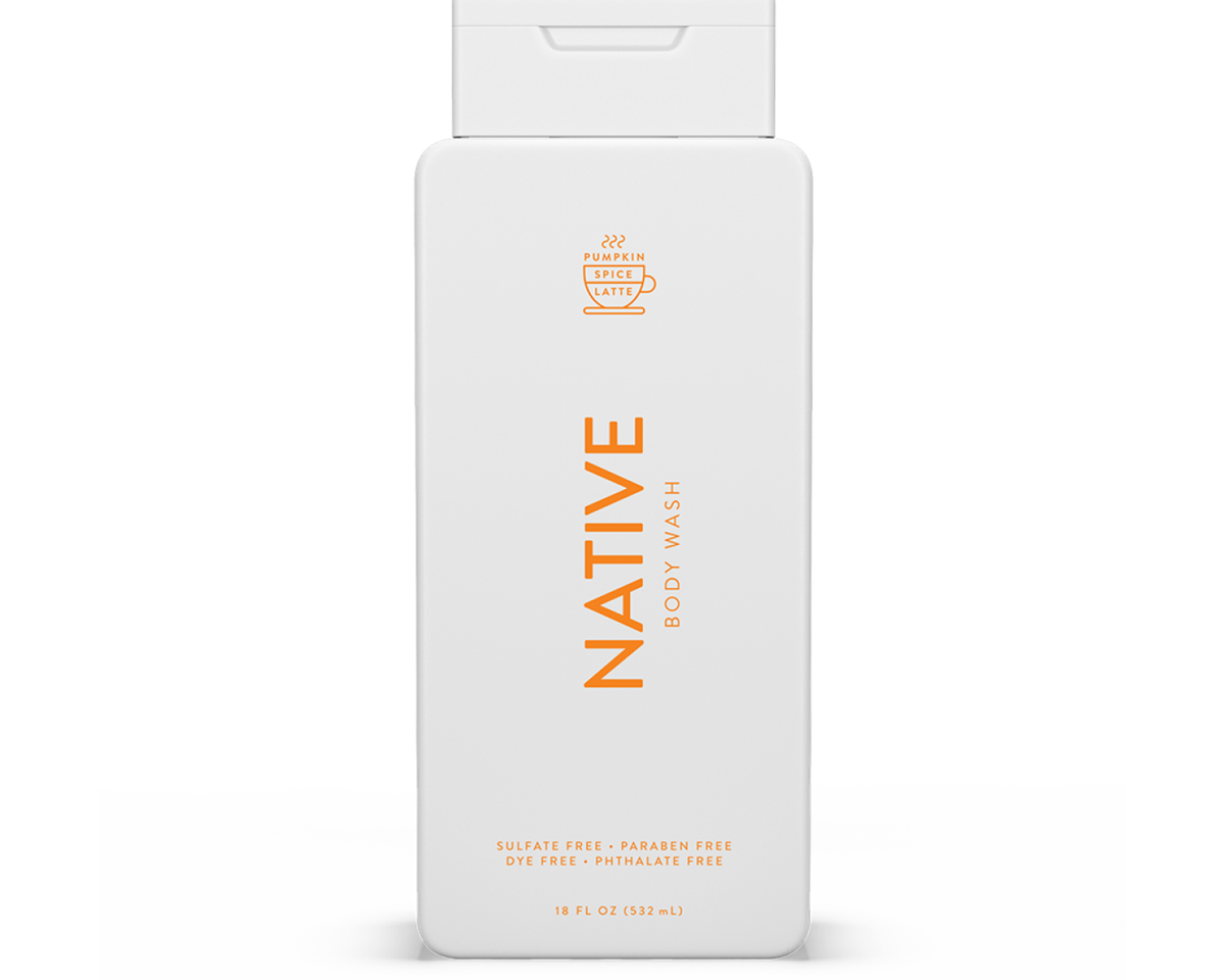 A white bottle of body wash with orange text