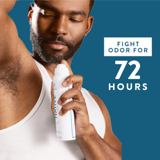 Person applying Native deodorant spray under arm with text reading 72-hour odor protection