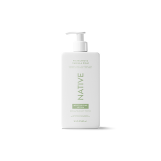 A white pump bottle of Native Cosmetics Moistening Lotion in Pistachio & Vanilla Chai scent, shown on a clean white background with a soft shadow.