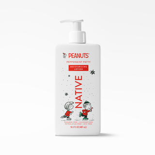 A white pump bottle of Peanuts Peppermint Patty Moisturizing Lotion on a clean white background. The label features red and black text and illustrations of Snoopy and Woodstock.