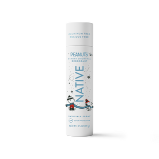 A single can of Peanuts Native Starry Snowball Deodorant on a clean white background. The can is white with blue text and illustrations of Snoopy and a penguin in a snowball fight.