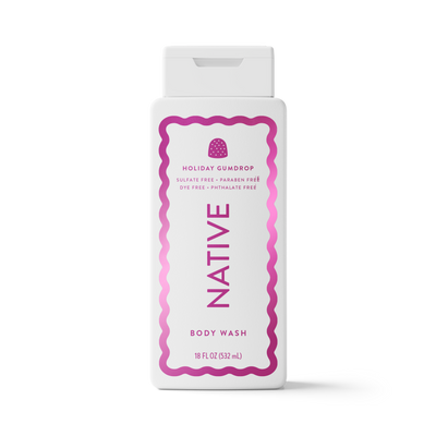 A white plastic bottle of Native Holiday Gumdrop body wash with a white flip-top cap, featuring a pink and magenta wavy border and text on the front label.