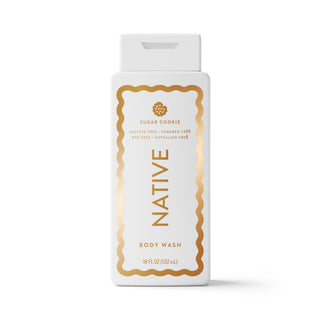 A white bottle of Native Sugar Cookie Body Wash with a white cap, featuring a gold decorative border and gold lettering on the front label, set against a plain white background.