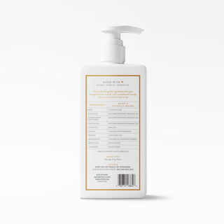 A white pump bottle shown from the back on a clean white background, featuring a gold-bordered label with text and a barcode.