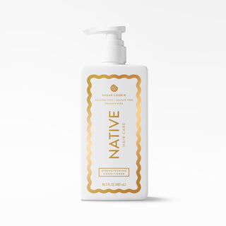 A white pump bottle of Native Hair Care Strengthening Conditioner with a gold and white label, set against a clean white background.