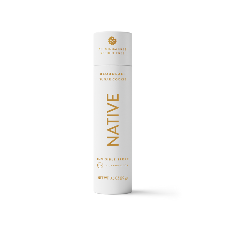 A single Native brand deodorant spray canister in a white cylindrical container with gold lettering and text, centered on a clean white background.