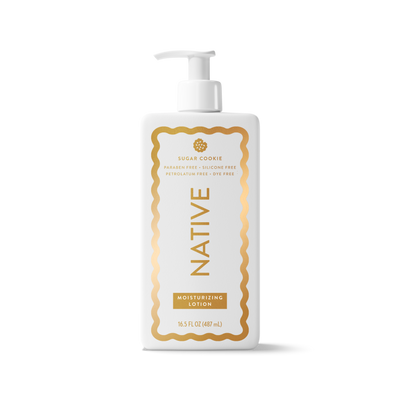 A white pump bottle of Native Sugar Cookie Moisturizing Lotion with a gold decorative border and gold lettering on the label, set against a clean white background.