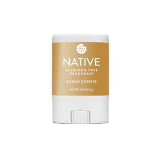 A Native brand aluminum-free deodorant stick in the Sugar Cookie scent, featuring a white container with a tan label and a white flip-top cap, centered on a plain white background.