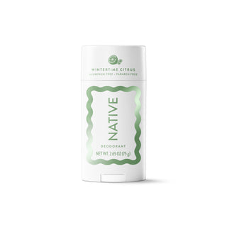 A white Native brand deodorant stick in Wintertine Citrus, featuring a white container with a light green wavy border and text, set against a plain white background.