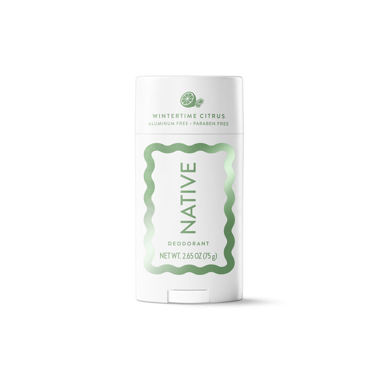 A white Native brand deodorant stick in Wintertine Citrus, featuring a white container with a light green wavy border and text, set against a plain white background.