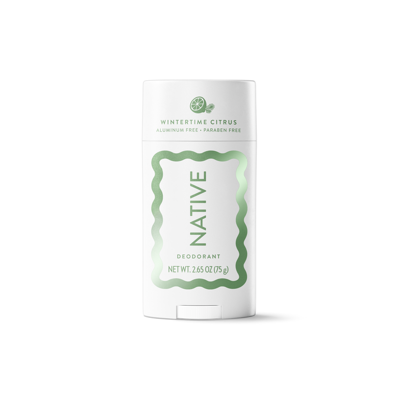 A white Native brand deodorant stick in Wintertine Citrus, featuring a white container with a light green wavy border and text, set against a plain white background.