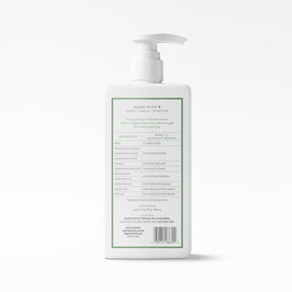 A white pump bottle of baby shampoo shown from the back, featuring a green-bordered label with text and a barcode on a clean white background.