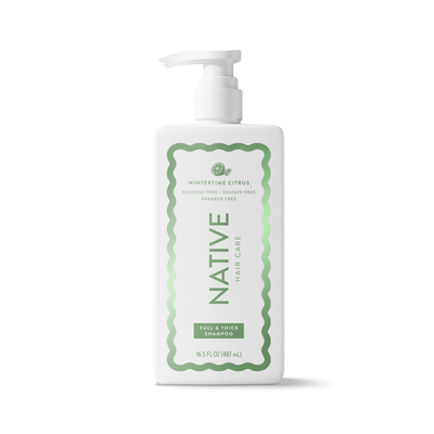 A white plastic pump bottle of Native Hair Care Full & Thick Shampoo with a green and white label, shown on a clean white background.