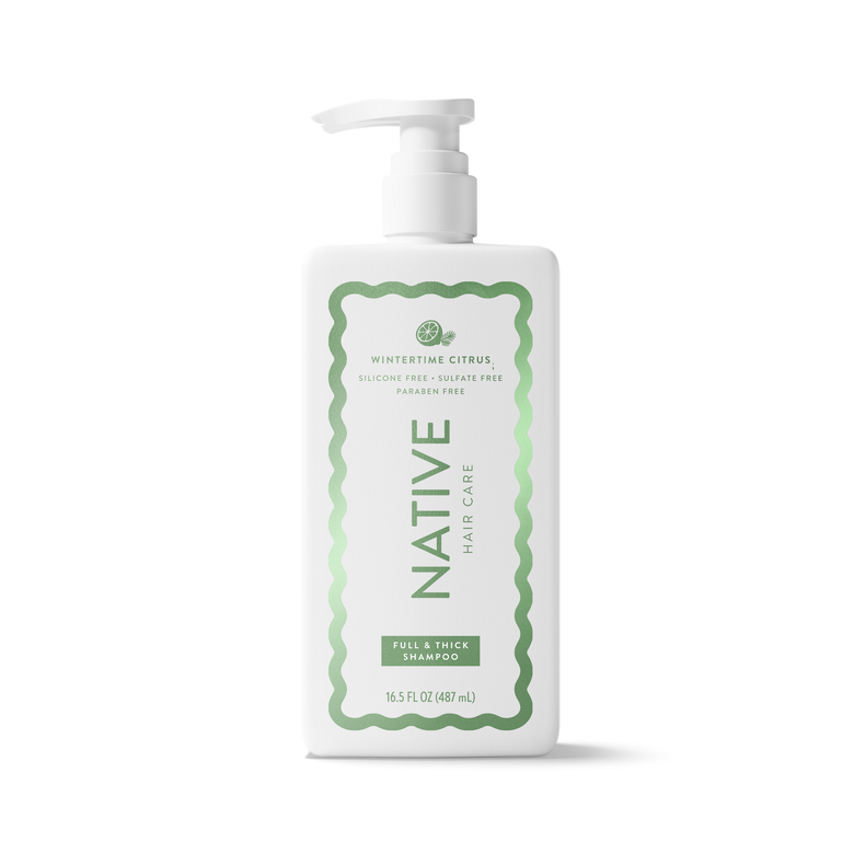 A white plastic pump bottle of Native Hair Care Full & Thick Shampoo with a green and white label, shown on a clean white background.