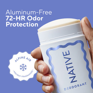 A hand holding a Native Deodorant stick against a blue background, with text reading 'Aluminum-Free 72-HR Odor Protection' and a badge that says 'Alpine Air Holiday Fragrances'.