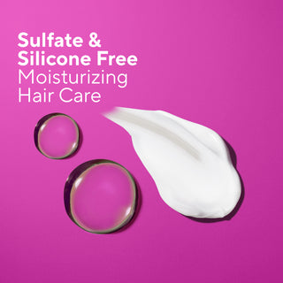 Promotional graphic for sulfate and silicone free moisturizing hair care, featuring white text on a vibrant magenta background, a smear of white cream, and two clear gel droplets.